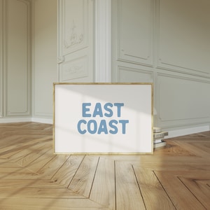 Minimalist typography wall art featuring the words “East Coast” in soft blue lettering on a clean off-white background. A modern, coastal-inspired print perfect for beach house decor, summer homes, living rooms, bedrooms or relaxed contemporary spaces. The simple design and airy colour palette create an effortless, laid-back seaside feel. This listing is for a digital download only. No physical print or frame included.