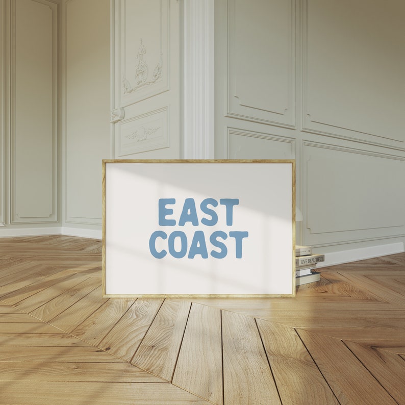 Minimalist typography wall art featuring the words “East Coast” in soft blue lettering on a clean off-white background. A modern, coastal-inspired print perfect for beach house decor, summer homes, living rooms, bedrooms or relaxed contemporary spaces. The simple design and airy colour palette create an effortless, laid-back seaside feel. This listing is for a digital download only. No physical print or frame included.