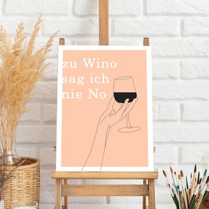 Könnte beinhalten: Ein pfirsichfarbener Kunstdruck auf einer Holzstaffelei. Der Druck zeigt eine Strichzeichnung einer Hand, die ein Weinglas mit Rotwein hält, mit dem Text "zu Wino sag ich nie No" in Weiß. Die Staffelei ist aus Holz.