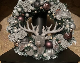 Beautiful bespoke artificial Christmas stag wreath in silver, grey and white.