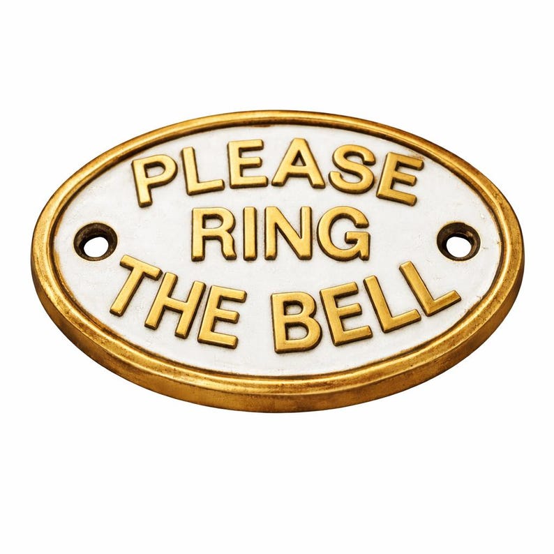 May include: An oval-shaped metal sign with a white background and a raised gold-coloured border. The sign features the embossed gold-coloured text "PLEASE RING THE BELL" in three lines. Two circular mounting holes are positioned on the left and right. classic door sign, classic brass plaque, elegant door sign, luxury brass sign, premium brass plaque, decorative plaque, decorative door sign, entrance door sign, front door plaque, front door sign, front entrance sign, doorbell reminder,