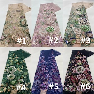 May include: Six pieces of embroidered lace fabric in various colors. The fabrics are decorated with floral patterns and sequins. Colors include beige, pink, green, navy, and black. Each piece is labeled with a number.