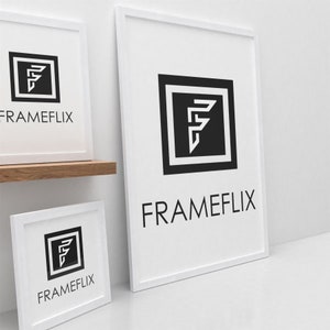 May include: Three white picture frames with black borders, each featuring a stylised black and white letter "F" with the text "FRAMEFLIX" below.