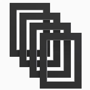 May include: Five black picture frames of different sizes are stacked on top of each other, creating a layered effect. The frames are all rectangular and have a simple, modern design.
