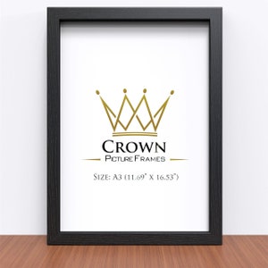 May include: Black picture frame with a gold crown logo and the text "CROWN PICTURE FRAMES" and "SIZE: A3 (11.69" x 16.53")"