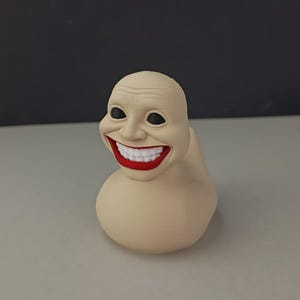 Cursed Rubber Duck Figurine: Creepy Human Face, 3D Printed Horror Decor