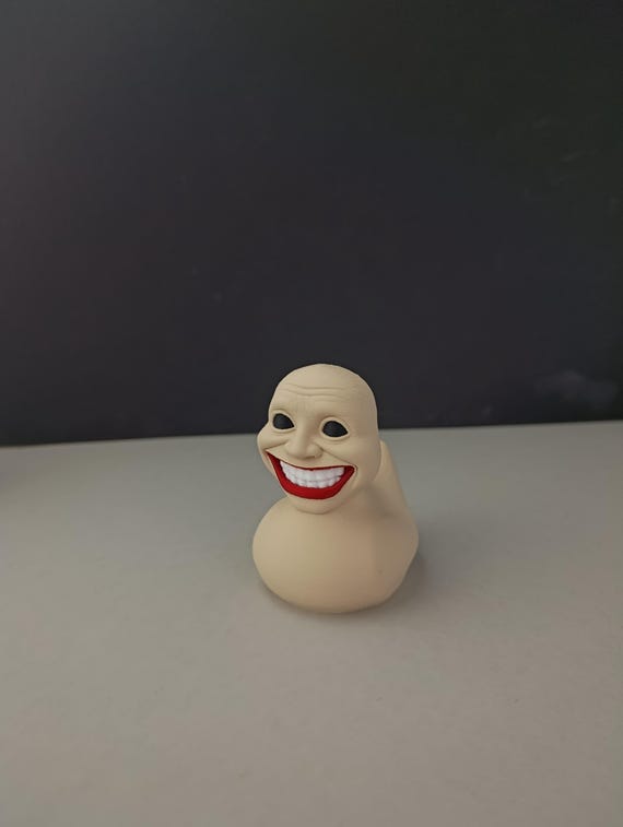 Cursed Rubber Duck Figurine: Creepy Human Face, 3D Printed Horror