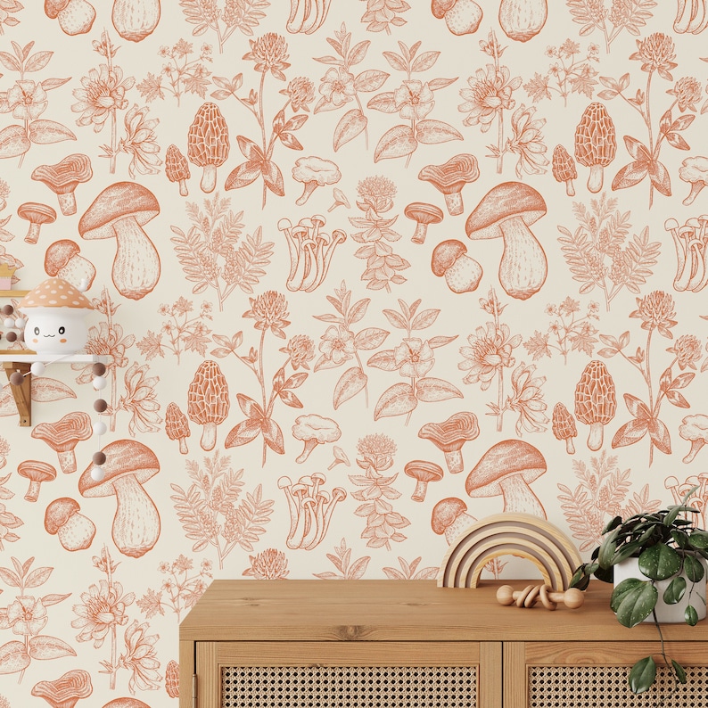 May include: A seamless pattern wallpaper featuring a repeating design of mushrooms and wildflowers in shades of orange and brown on a cream background.
