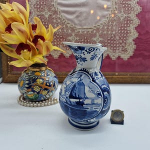 May include: A set of three ceramic mugs with a speckled, matte finish. The mugs are in shades of cream, light gray, and dark gray. Each mug has a simple, minimalist design, perfect for coffee or tea. The mugs are approximately 4 inches tall.