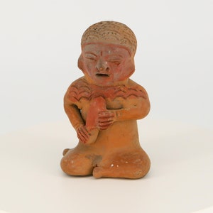 Vintage pre-Columbian figurine from Ecuador. Replica of an ancient Mayan statuette.