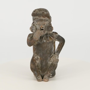 Vintage pre-Columbian figurine from Ecuador. Replica of an ancient Mayan statuette.