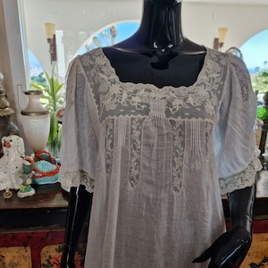 Antique nightgown, made of the finest linen with lace, late 19th century .