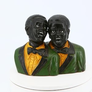 Statuetta vintage in ceramica raffigurante un duo vocale – stile cartone animato afroamericano
