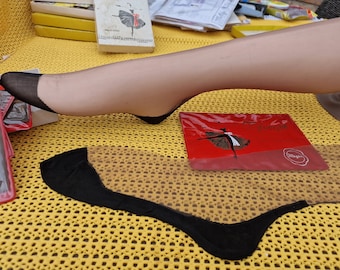 Vintage stockings from the 1960s. Black seamed stockings.