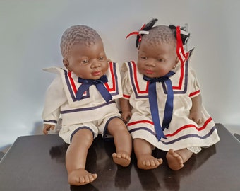 A pair of boy and girl twin dolls Produced by Spain.