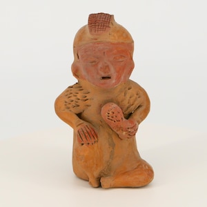 Vintage pre-Columbian figurine from Ecuador. Replica of an ancient Mayan statuette.