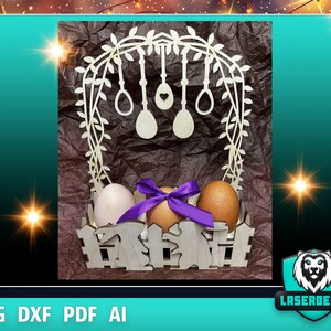 May include: Wooden Easter egg holder with a decorative floral arch and three eggs. The holder is painted white and has a rustic brown background.