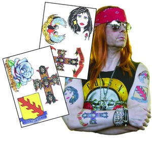 May include: A set of temporary tattoos featuring images of a rose, a cross with skulls, a bird, a woman's face, and a banner with the text "Victory or Death".