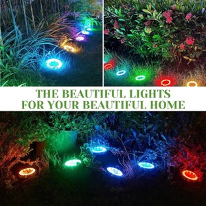 May include: Colourful outdoor garden lights in blue, green, red, and purple. The lights are set in grass and amongst plants. Text reads: "THE BEAUTIFUL LIGHTS FOR YOUR BEAUTIFUL HOME."