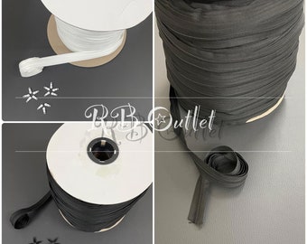 Cojines tapizados con cadena y deslizadores de nailon No3 con cremallera continua en blanco y negro
