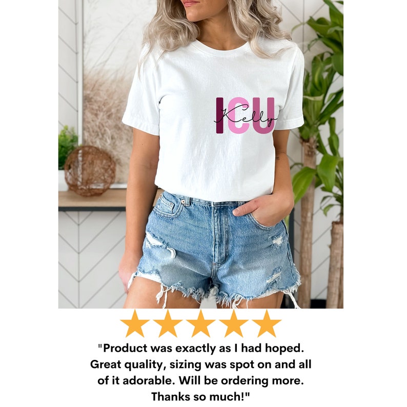 May include: White t-shirt with the text "ICU" in pink and burgundy letters. The text "Kelly" is written in cursive below the letters. The shirt is being worn by a person.