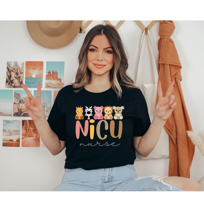 May include: A black t-shirt with a graphic of five cartoon animals and the text "NICU nurse".