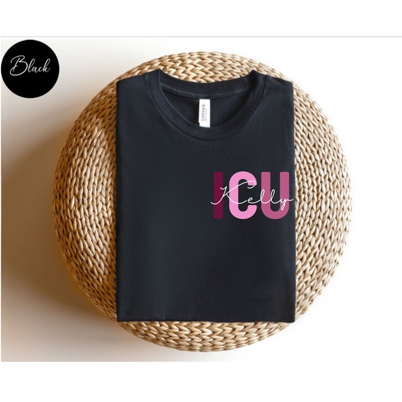 May include: Black t-shirt with the text "ICU Kelly" in pink and burgundy lettering.