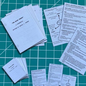 May include: A stack of white paper screenplays titled The Quiet Tenant written by Daniel J. Harker, accompanied by several printed casting call sheets and character development notes with black text on white paper, all featuring punched holes.