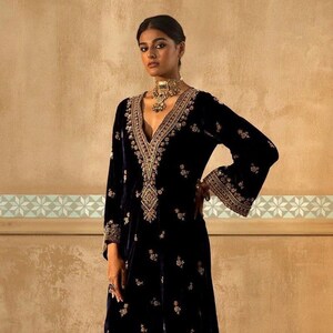 Designer suit top with umbrella sleeves