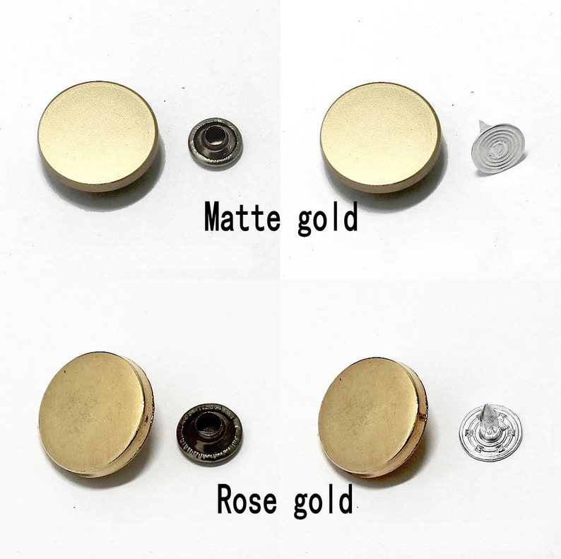 May include: Two sets of gold-toned metal snap buttons, one set in matte gold and one set in rose gold. Each set includes a button, a post, and a cap.
