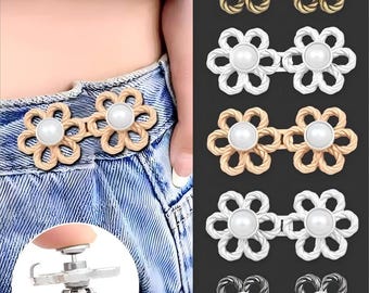May include: Flower-shaped jean button replacements in gold, silver, and bronze tones, each with a central pearl. The buttons are shown attached to denim jeans. The image also shows a tool for easy installation. Text on the image reads "Nail Free Hand Press."