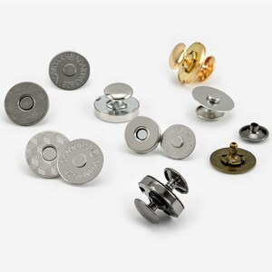 May include: Assortment of magnetic snaps and metal buttons in silver, gold, and bronze finishes. The snaps have a flat, circular design with a raised centre. The buttons have a round, domed shape with a small post on the back.