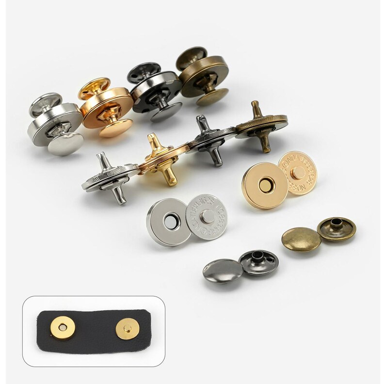May include: Assortment of magnetic snap closures in various finishes, including gold, silver, and black. The snaps are shown in both open and closed positions. The image also includes a close-up of two snaps attached to a black leather strap.