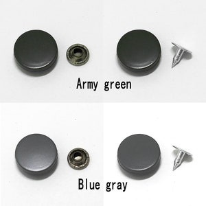 May include: Two sets of metal snaps, one in army green and one in blue gray. Each set includes two round snaps and a metal post.