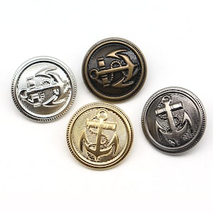 Peut inclure: Quatre boutons métalliques avec des motifs d'ancre en argent, bronze, or et canon de fusil. Chaque bouton présente un emblème d'ancre détaillé dans un cadre circulaire, adapté aux projets sur le thème nautique.