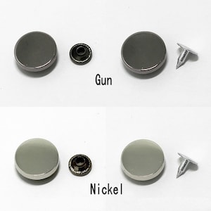 May include: Two sets of metal snaps, one set in gunmetal and one set in nickel. Each set includes a snap, a stud, and a post.