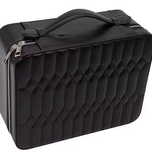 May include: Black quilted travel case with a zipper closure and a top handle.