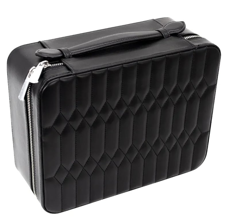 May include: A black quilted leather jewelry box with a silver zipper and a handle.
