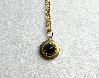 SMALL Antique brass LOCKET with Dark Ruby Red glass cabochon in lace edge setting on 16" necklace.  Perfect for Layering.