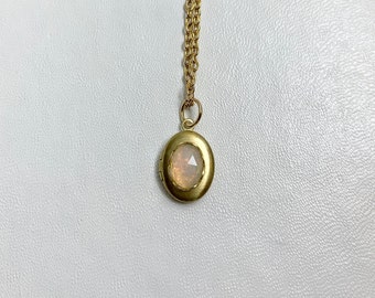 SMALL Antique style brass LOCKET with Natural Ethiopian Opal cabochon in a lace edged setting on 16" necklace.  Perfect for Layering.