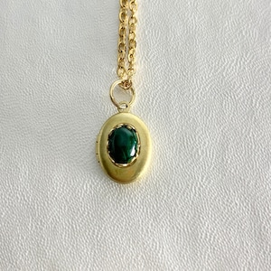SMALL Antique brass LOCKET with Malachite cabochon in a lace edged setting on 16" necklace.  Perfect for Layering.