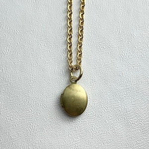 TINY Oval Antique brass LOCKET on 18&quot; necklace.  Perfect for Layering.