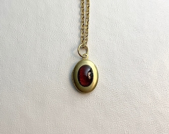 SMALL Antique brass LOCKET with Natural Garnet cabochon on 16&quot; necklace.  Perfect for Layering.