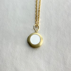 SMALL Antique brass LOCKET with Vintage Mother of Pearl cabochon on 16&quot; necklace.  Perfect for layering.