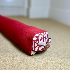 Handmade Draught Excluder, Red Plain Fabric, Patterned Ends with Handle. 75cm long.
