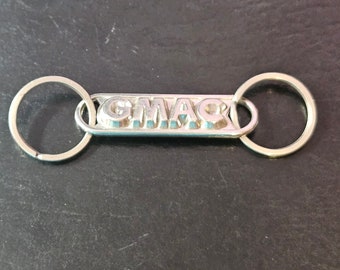 Llavero vintage con emblema de camiones GMC para entusiastas de los camiones