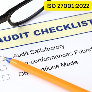 May include: A checklist for an ISO 27001:2022 audit. The checklist has three boxes with check marks next to them. The boxes are labeled "Audit Satisfactory", "Non-conformances Found", and "Observations Made". A pen is lying on top of the checklist.