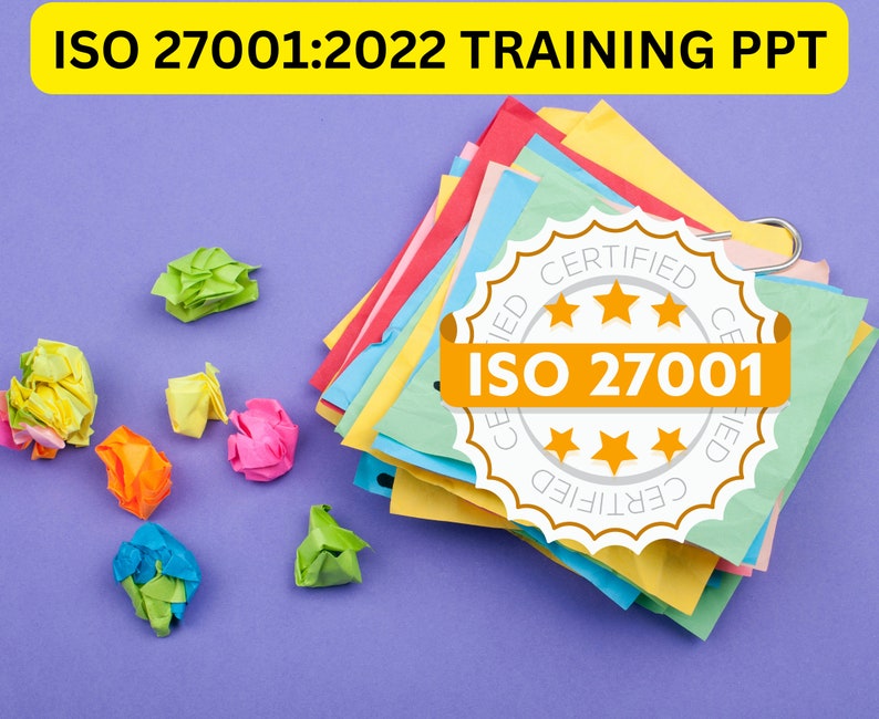 May include: A stack of colorful sticky notes with a white circle seal that says "CERTIFIED" and "ISO 27001" in orange text. The seal has five gold stars. The notes are on a purple surface with crumpled pieces of paper in various colors.