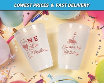 May include: Two white plastic cups with red text and illustrations. One cup says "ONE Little Meatball" with a meatball illustration. The other says "Jacob's 1st Birthday" with a spaghetti illustration. The top banner says "LOWEST PRICES & FAST DELIVERY".