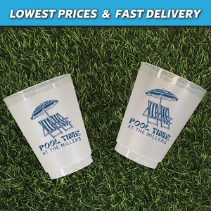 May include: Two white plastic cups with blue text and a graphic of beach chairs and an umbrella. The text on the cups reads "Pool Time at the Millers".
